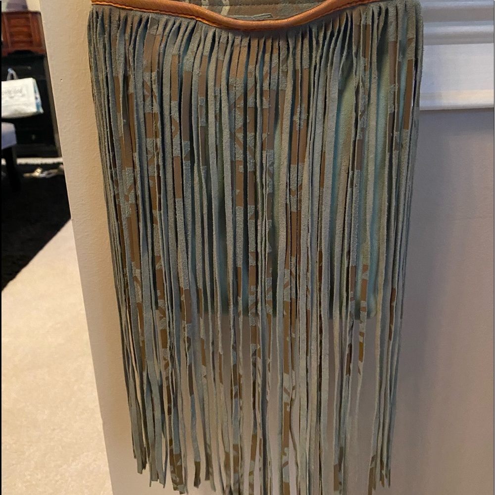 Beautiful leather purse with tassels.
